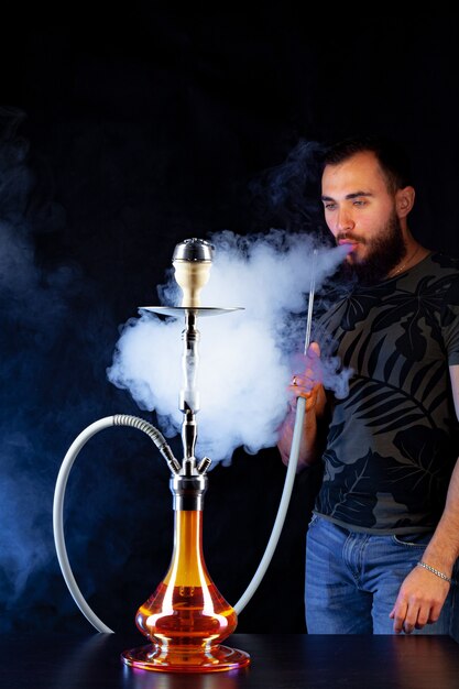 Luxury vaping experience Dubai cafe, person enjoying vape in elegant setting, high-end shisha alternative - Want a Lounge Experience at Home? Try The Best Shisha Cafe Dubai ...