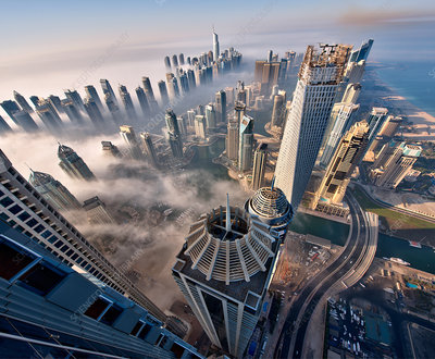 Vaping in Dubai cityscape, UAE urban vape scene, vapor clouds over Emirates skyline, modern Dubai lifestyle - Cityscape above the clouds in Dubai - Stock Image - F020/4694 ...