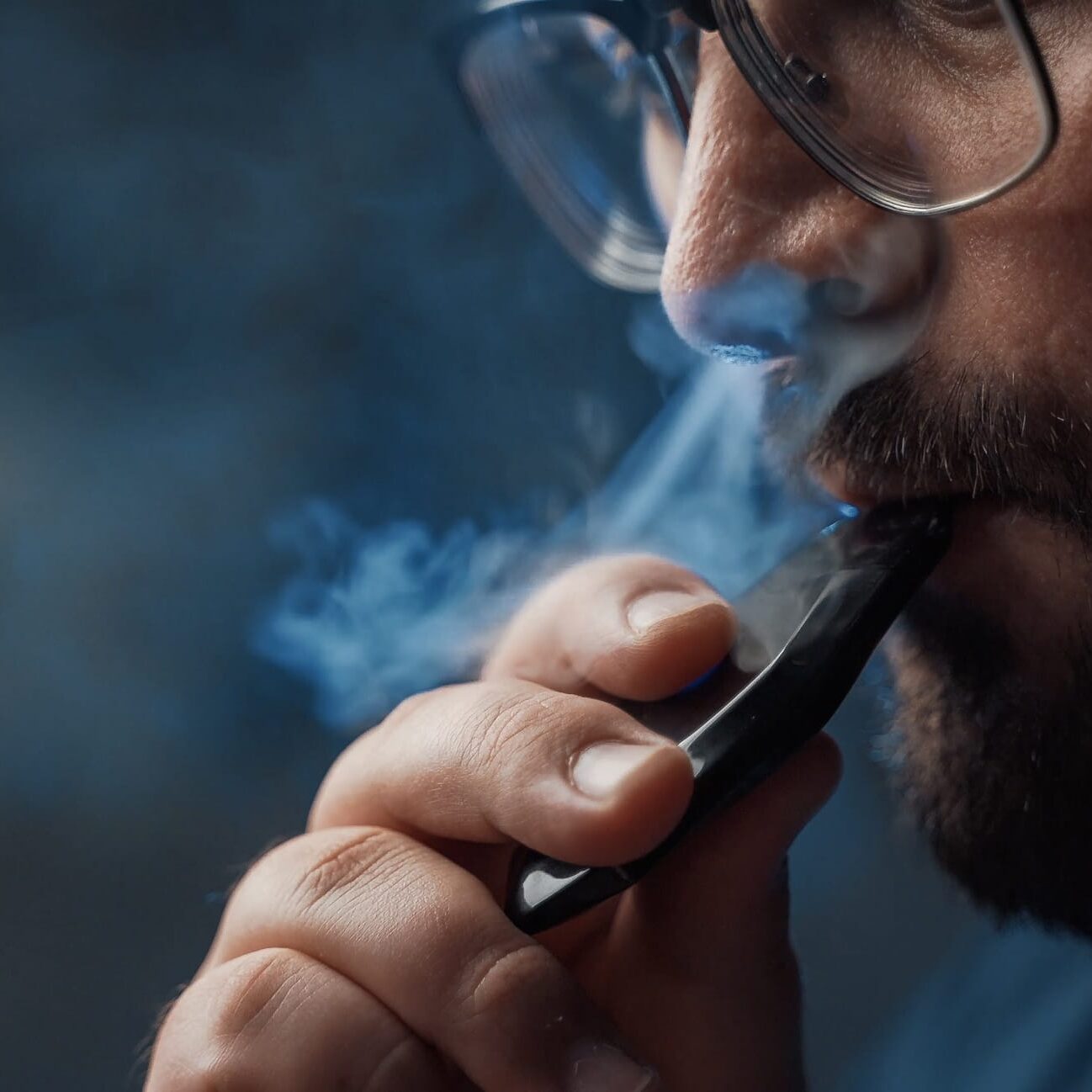 Person transitioning from cigarette to vape, high nicotine satisfaction, ex-smoker finding relief in vape - Smokers Switching to Vaping See Improved Respiratory Health ...