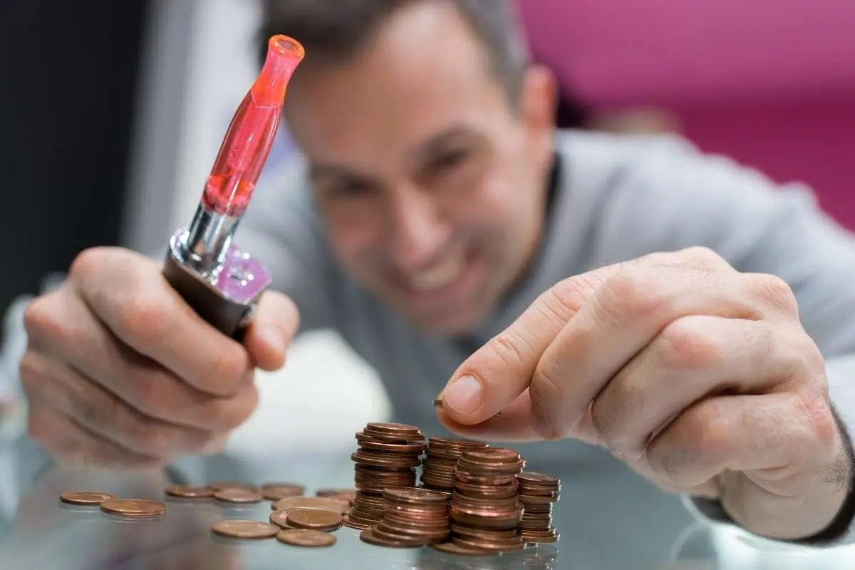 Money saving vaping, budget friendly e-shisha, person enjoying vape while saving money, smart choice conclusion vape - Vaping on a Budget – Our Top Tips - Red Vape